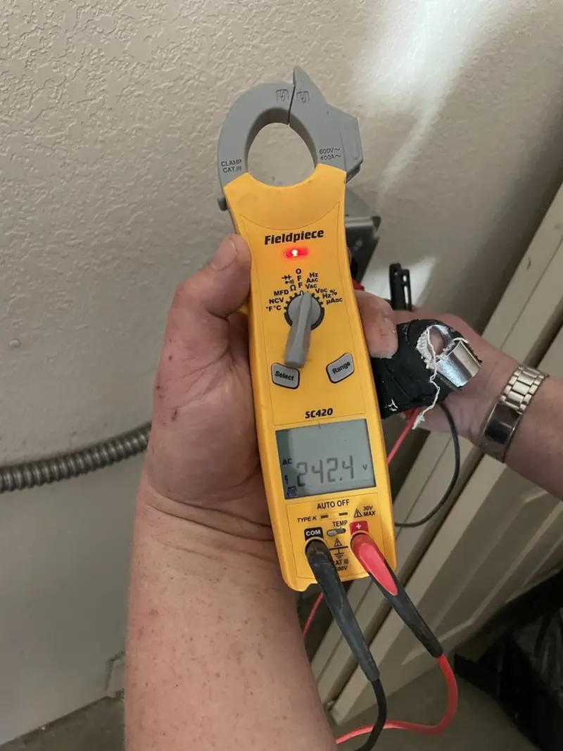Voltage testing with clamp meter during Generator Installation in Leesburg